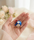Blue bird brooch